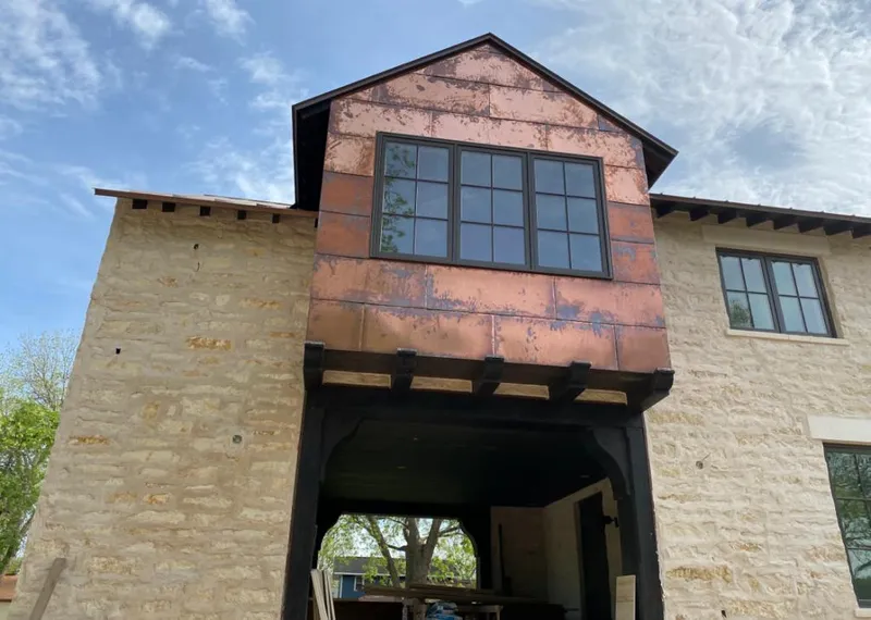 Copper metal panel facade on a stone building for Metal Roof Coating in Moon
