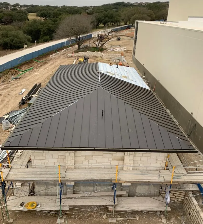 Metal roof new construction with scaffolding in Moon